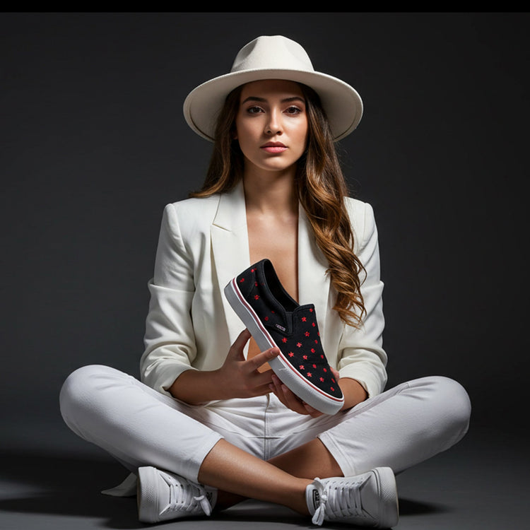Stylish woman showcasing custom slip-on shoes for women in a chic outfit against a dark background