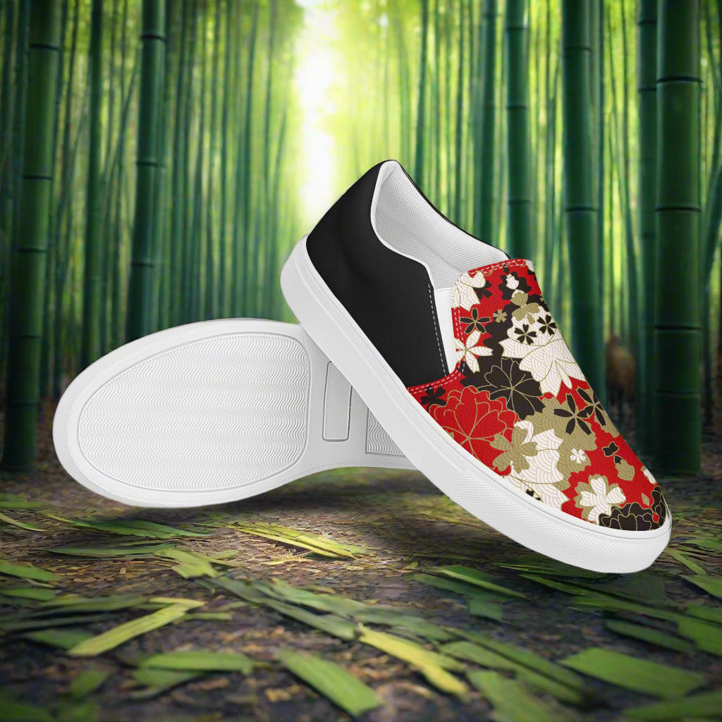 Black Lotus Halftone Slip-on Canvas Shoes with a floral design and white sole on a nature background