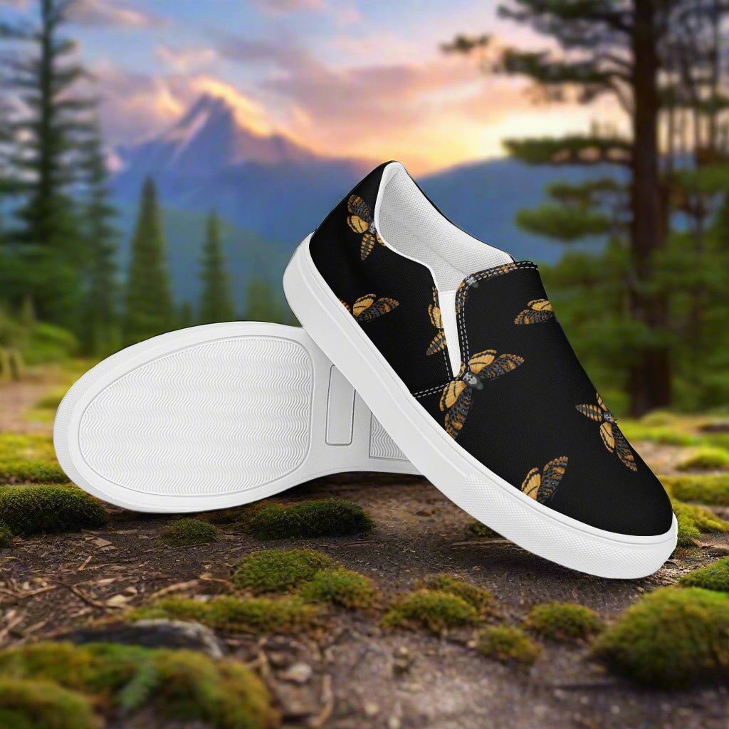 Black Moth Slip-on Canvas Shoes featuring a stylish moth design on a black background