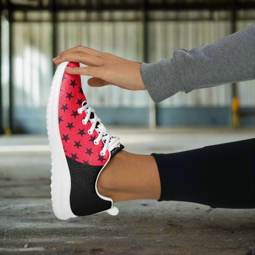Black Stars Red Halftone Womens Athletic Shoes by WildSage Market worn during stretching exercise