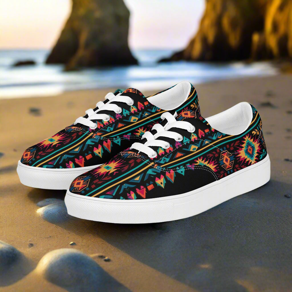 WildSage Market Southwest patterned Lace-up Canvas Shoes with colorful tribal print, white laces and rubber sole on sandy beach