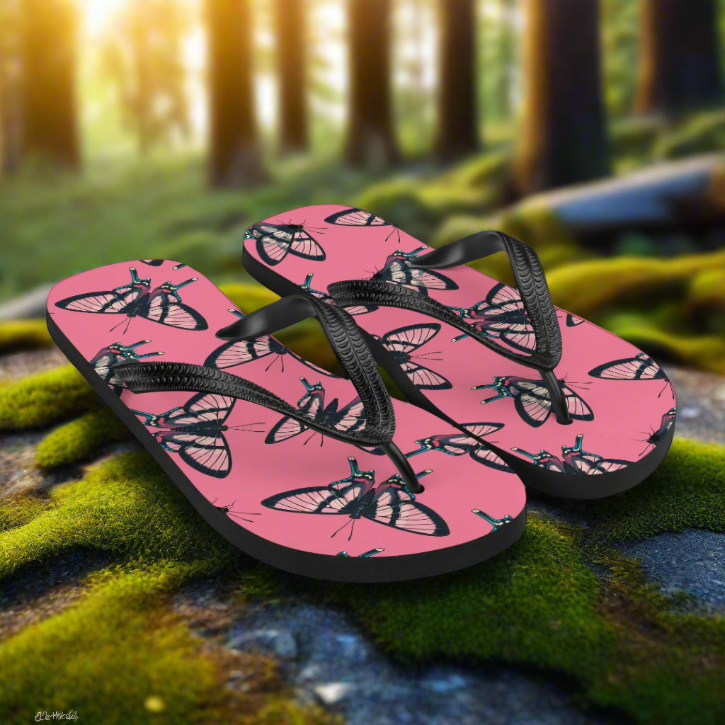 Pink butterfly print flip-flops with black straps designed for comfort and style