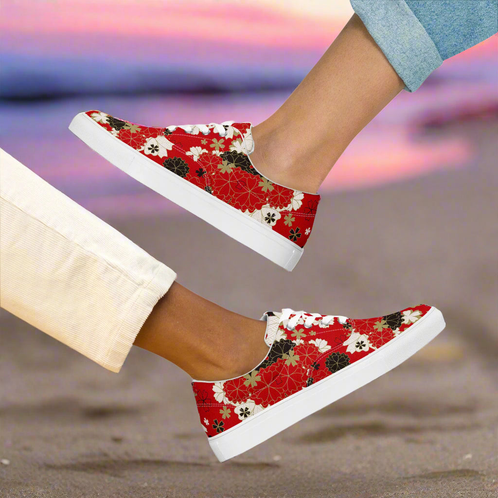 WildSage Market Custom Lace-up Canvas Shoes red floral low top sneakers on model feet at sunset beach