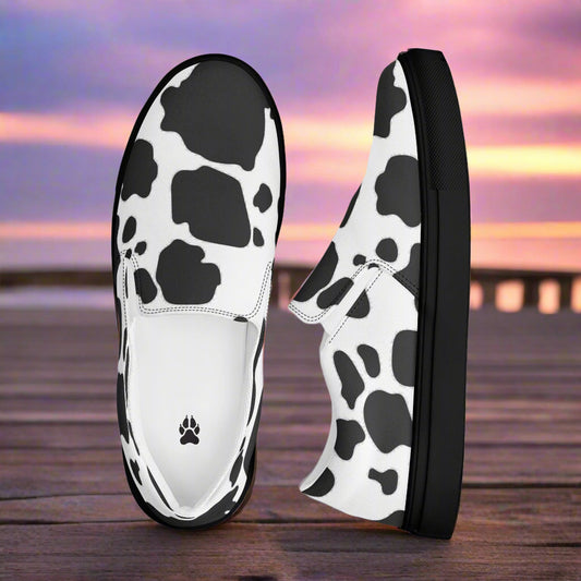 Cowhide Black Slip-on Canvas Shoes by WildSage featuring a stylish cow print design