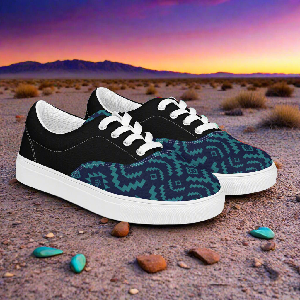 WildSage Market Southwest patterned Lace-up Canvas Shoes in black with teal Aztec pattern and white soles on desert backdrop