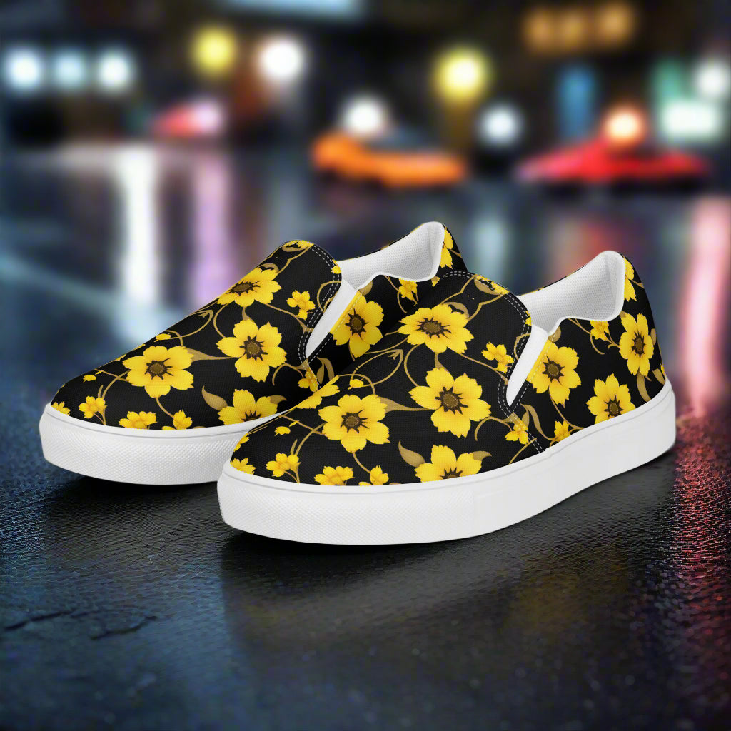 Floral Print Slip-on Canvas Shoes Yellow Bloom featuring a vibrant yellow floral pattern on a black background