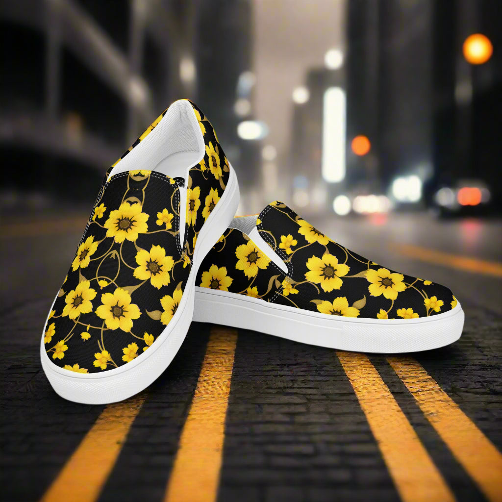 Floral Print Slip-on Canvas Shoes Yellow Bloom with vibrant yellow flowers on a black background