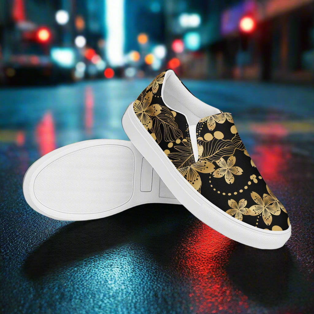 Golden Lily Slip-on Canvas Shoes with a Floral Design on Black Background for Stylish Casual Wear