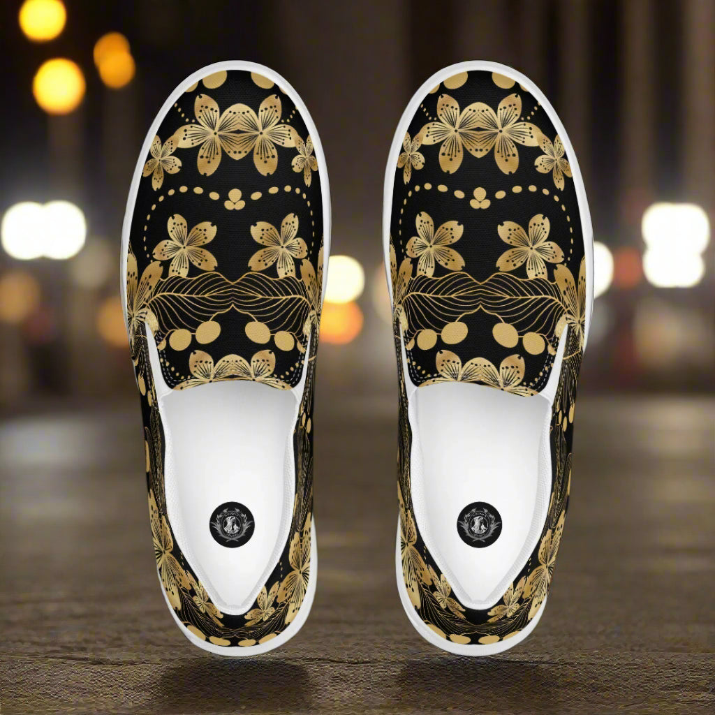 Golden Lily Slip-on Canvas Shoes featuring a floral design in black and gold colors