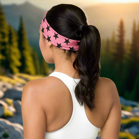 WildSage Market headband pink black stars worn by woman in ponytail outdoor with white tank top
