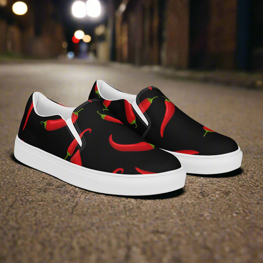 Hot Chili Slip-on Canvas Shoes featuring a vibrant chili pepper design on a black background