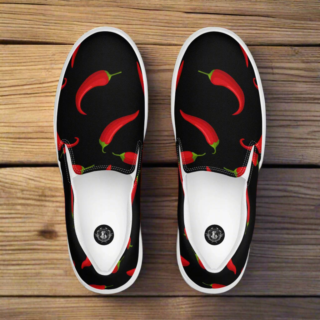 Hot Chili Slip-on Canvas Shoes featuring a vibrant chili pepper pattern on a black background