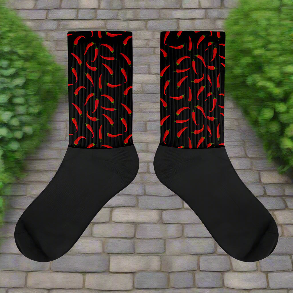 Hot Chili Unisex Black Bottom Socks featuring vibrant red chili designs on a black background