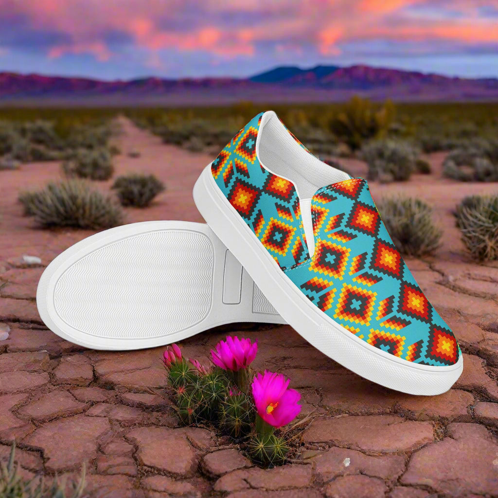 Huichol Southwest Print Slip-on Canvas Shoes with vibrant colors in a desert landscape