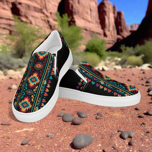 Ixtlan Southwest Print Slip-on Canvas Shoes featuring a vibrant geometric pattern against a desert backdrop