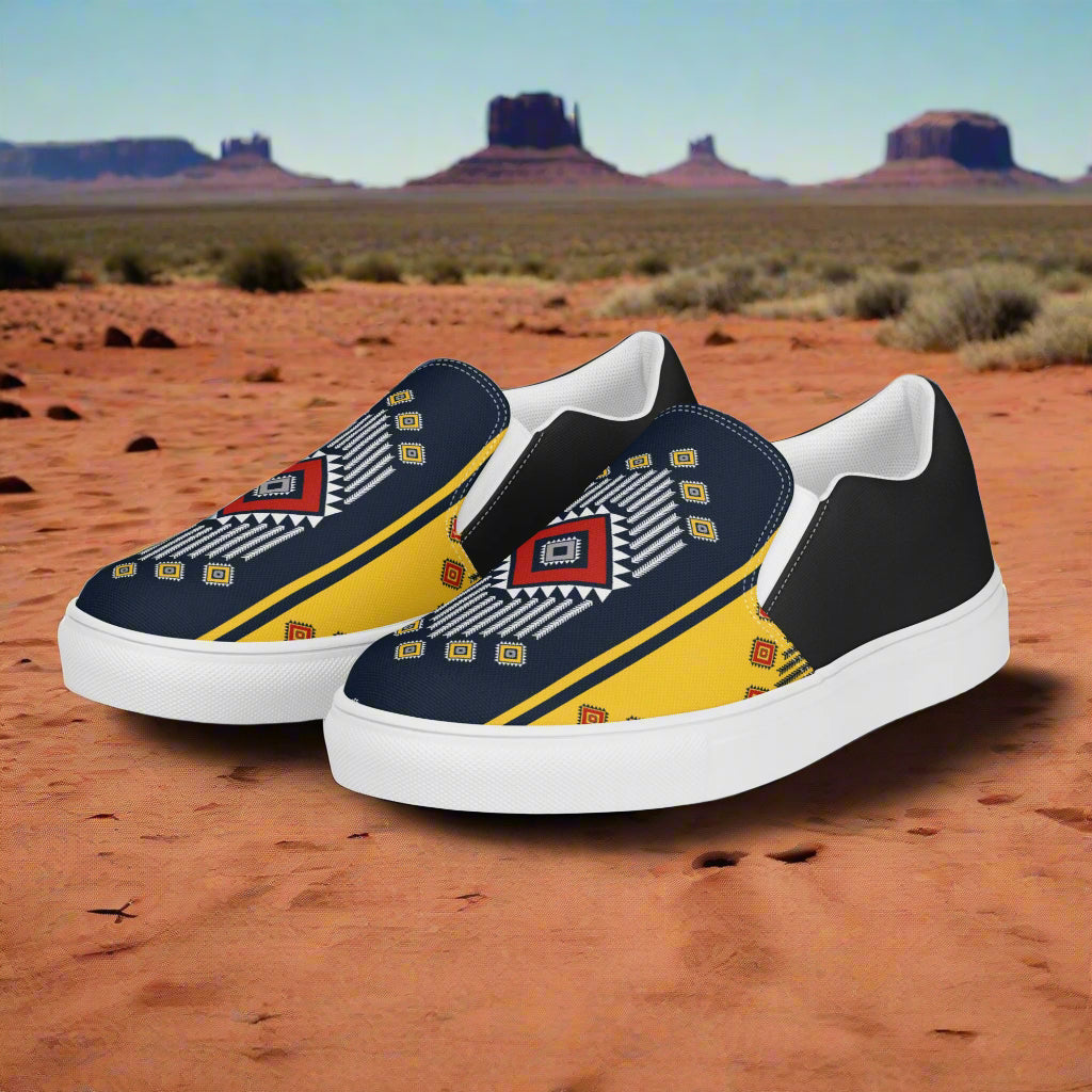 Slip-on Canvas Shoes Kaibito Halftone in a vibrant desert setting with unique tribal patterns