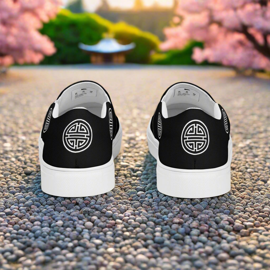 Longevity Black Slip-on Canvas Shoes featuring a minimalist design with logo at the rear