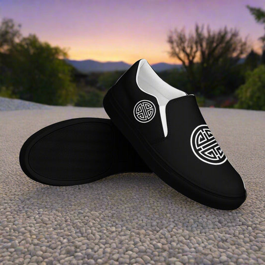 WildSage Longevity Black Slip-on Canvas Shoes featuring a unique logo design for comfortable wear