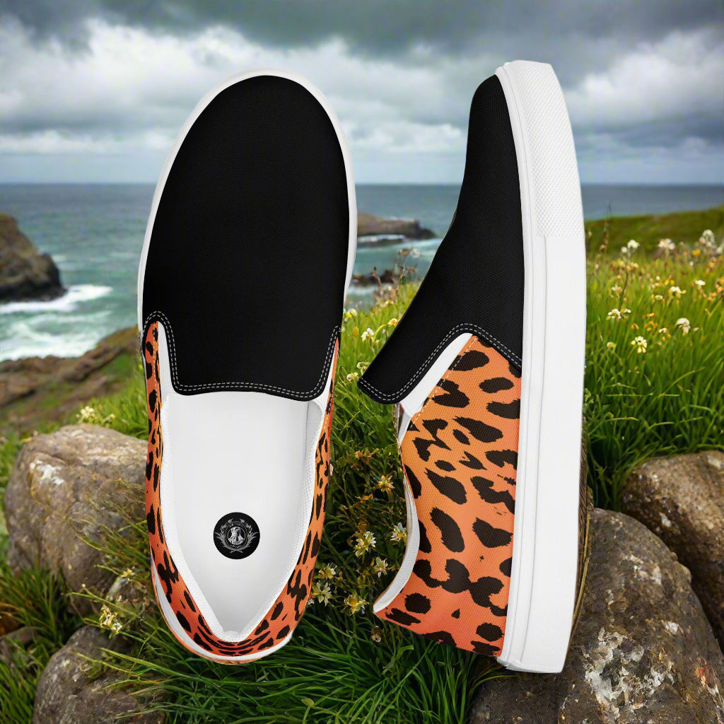 Men's custom black two tone slip on canvas shoes with a cheetah animal skin pattern