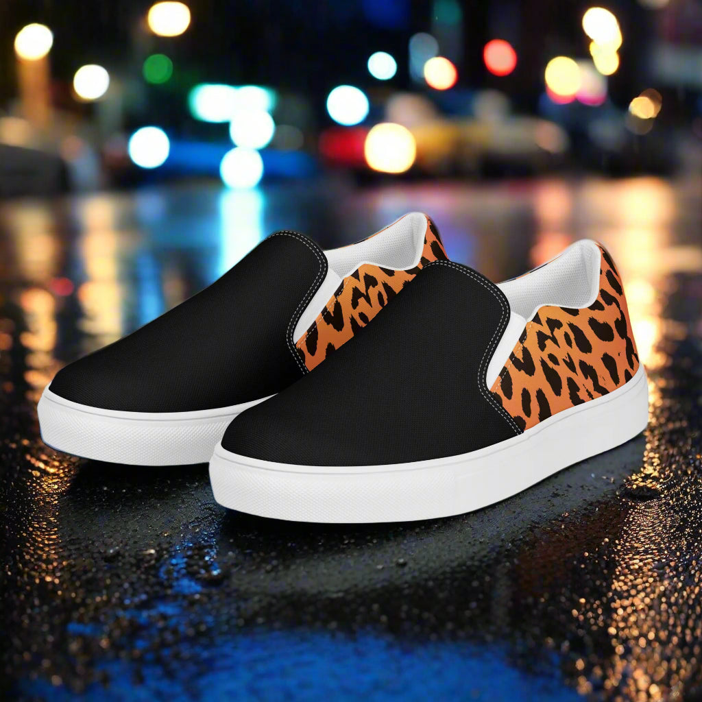 Men's custom black two tone slip on canvas shoes with a cheetah animal skin pattern