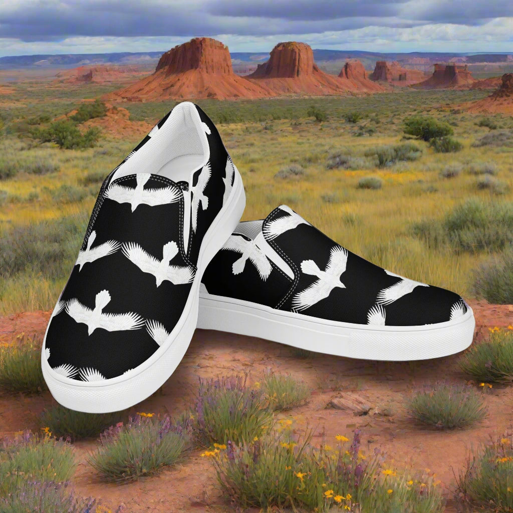 Mens white raven print slip on shoes with black background and white rubber sole by WildSage Market