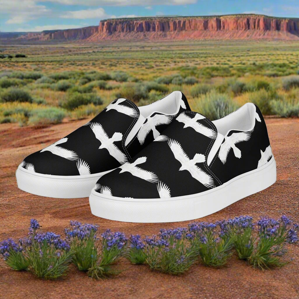 WildSage Market mens white raven print slip on shoes with black background and white sole