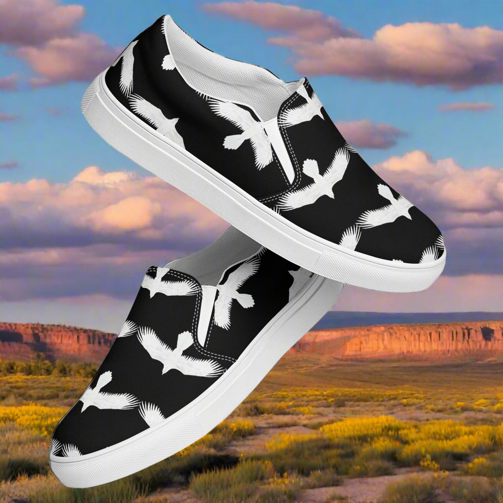 WildSage Market mens white raven print slip on shoes with black background and white bird design
