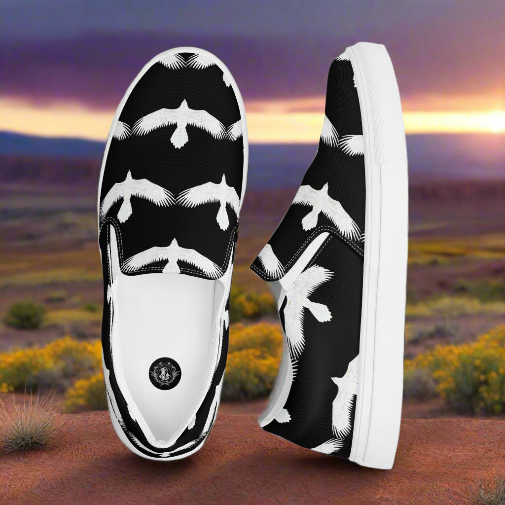 WildSage Market mens white raven print slip on shoes with black background and white raven design