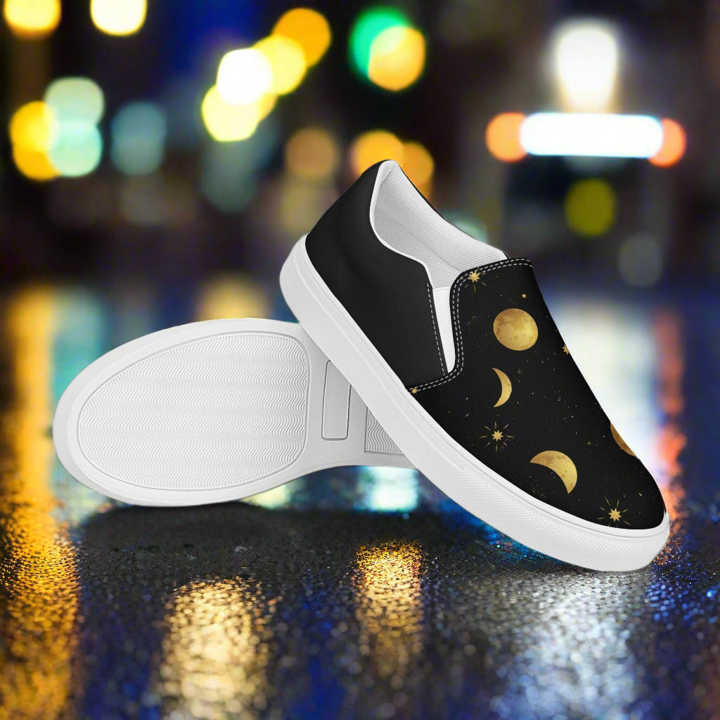 Moonstar Halftone Slip-on Canvas Shoe featuring a black background with moon and star patterns