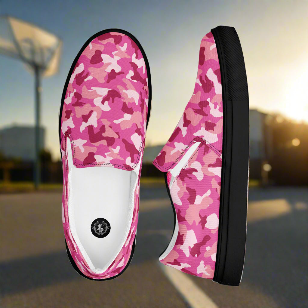 WildSage Market pink camo slip on shoes with black soles shown outdoors near basketball court