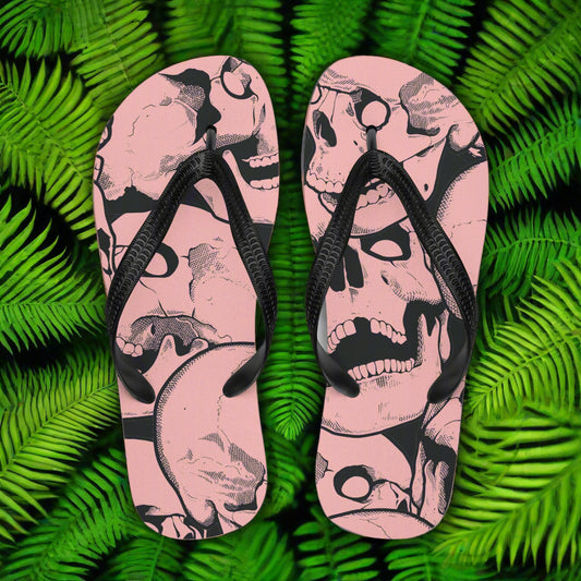 Pink skull print flip flops with black straps, featuring a unique design for stylish summer footwear