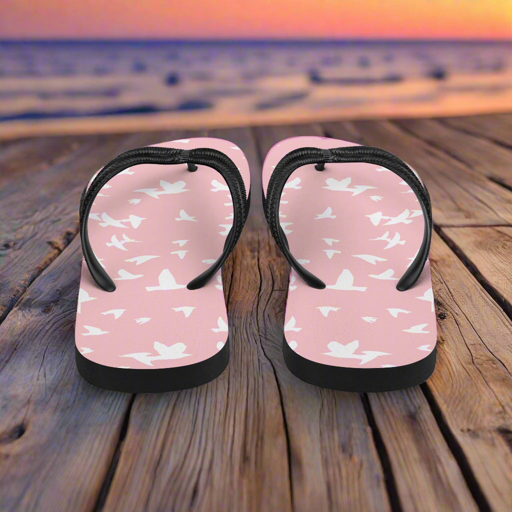 Pink white bird print flip-flops with a comfortable sole for casual summer wear