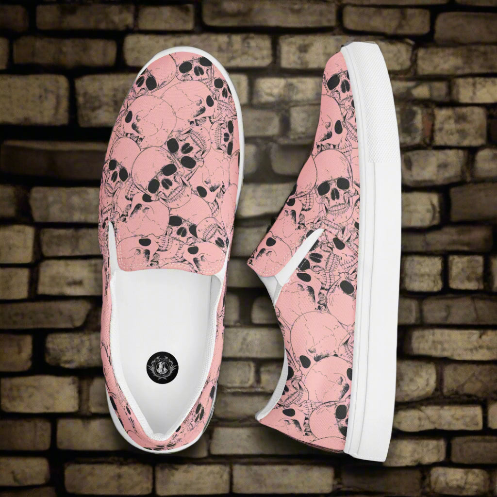 WildSage Market slip on shoes with pink skull pattern and white soles on brick background