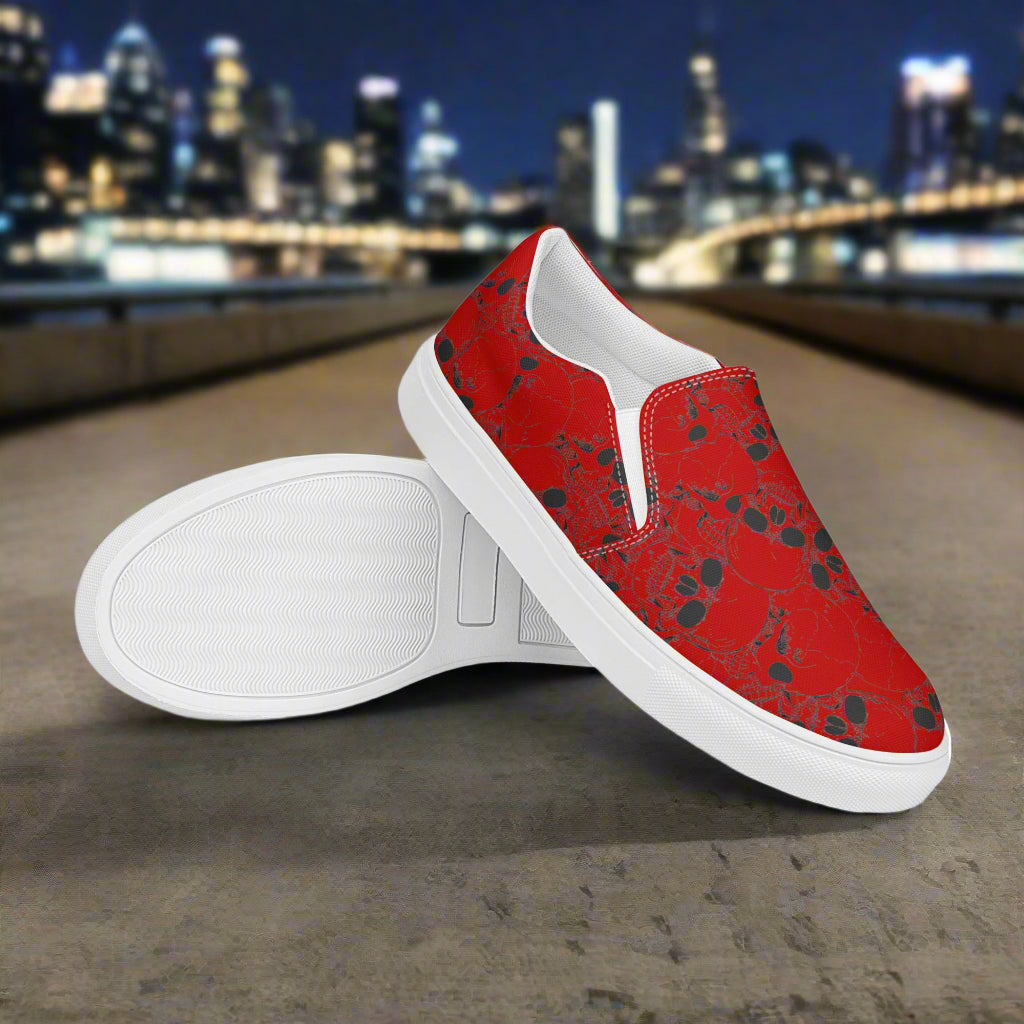 WildSage Skull Pile Crimson Slip-On Canvas Shoes with a vibrant red skull design on a white sole