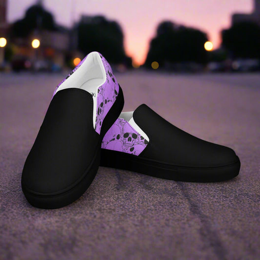 Skull Pile Purple Two Tone Slip-On Canvas Shoes by WildSage featuring a unique design with black and purple details