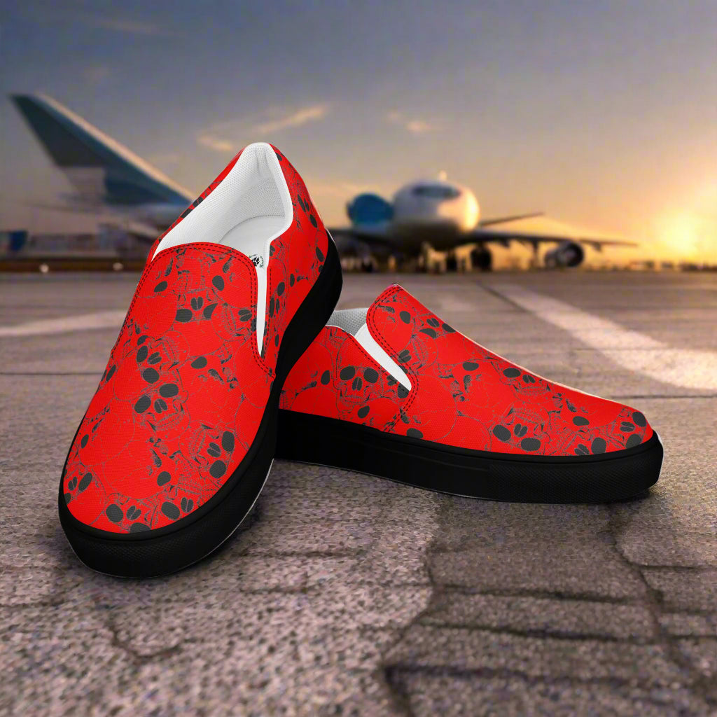 Skull Pile Red Slip-On Canvas Shoes by WildSage with a bold skull print for casual style