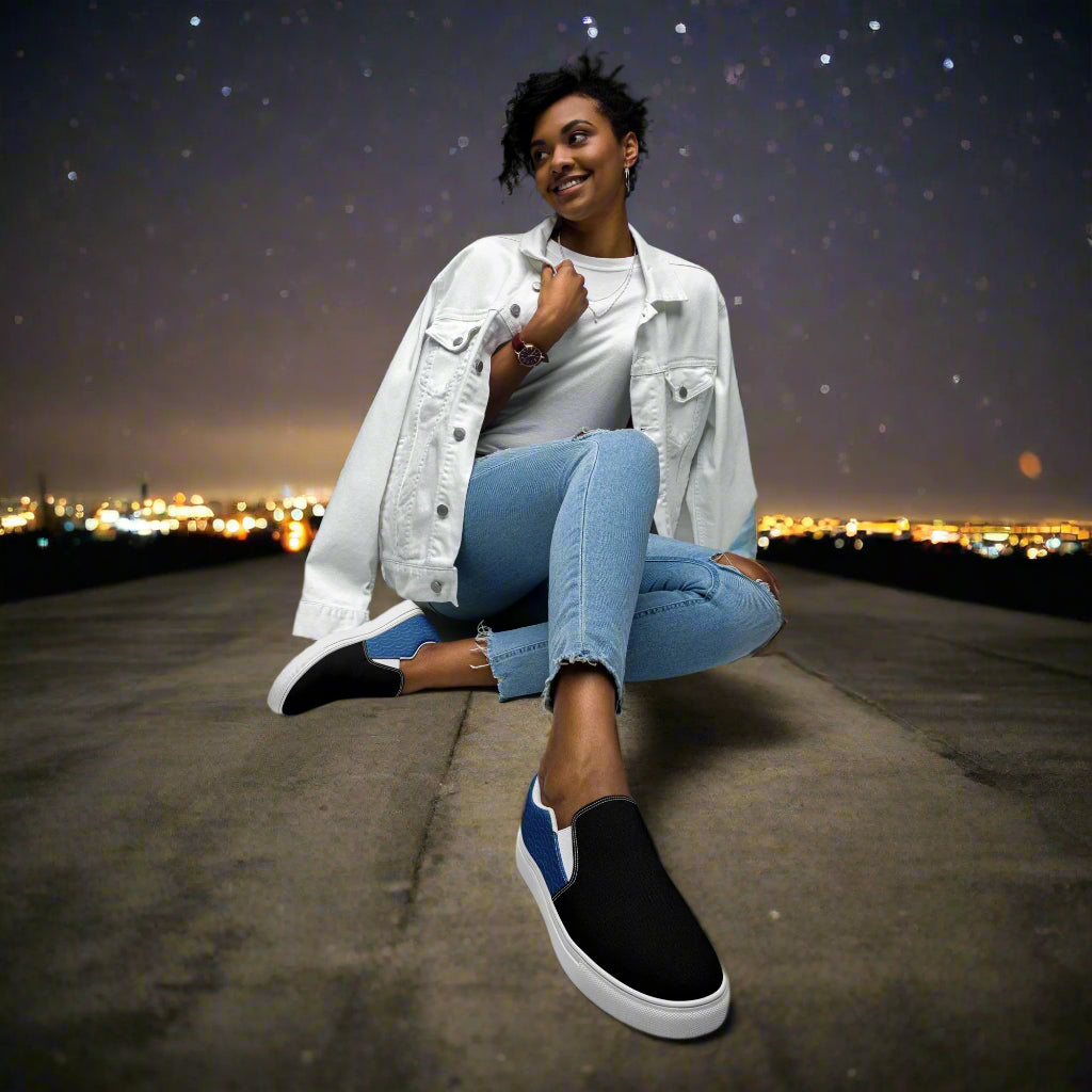 Model wearing Slip-on Canvas Shoes Blue Seas Two Tone with casual outfit against a night city skyline