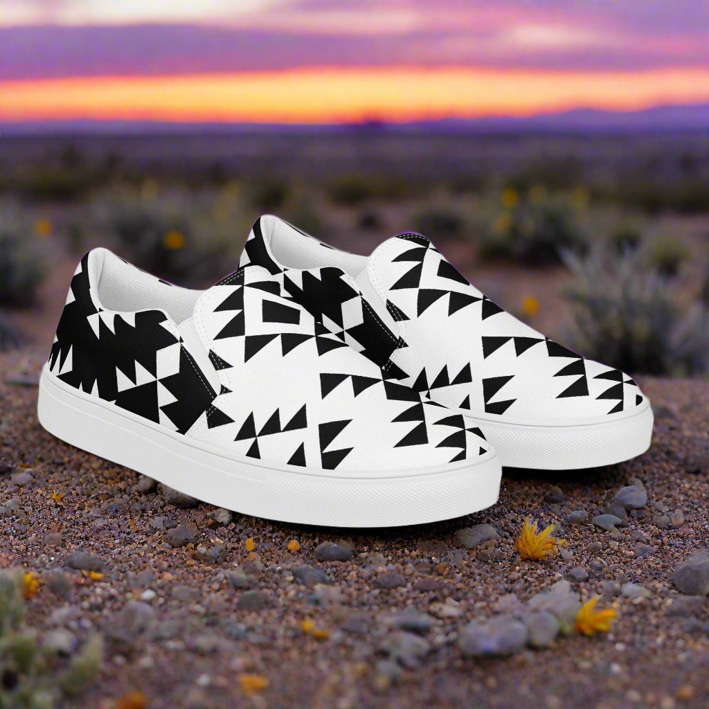 Slip-On Canvas Shoes Sonora Reverse Halftone in black and white geometric design on a desert landscape