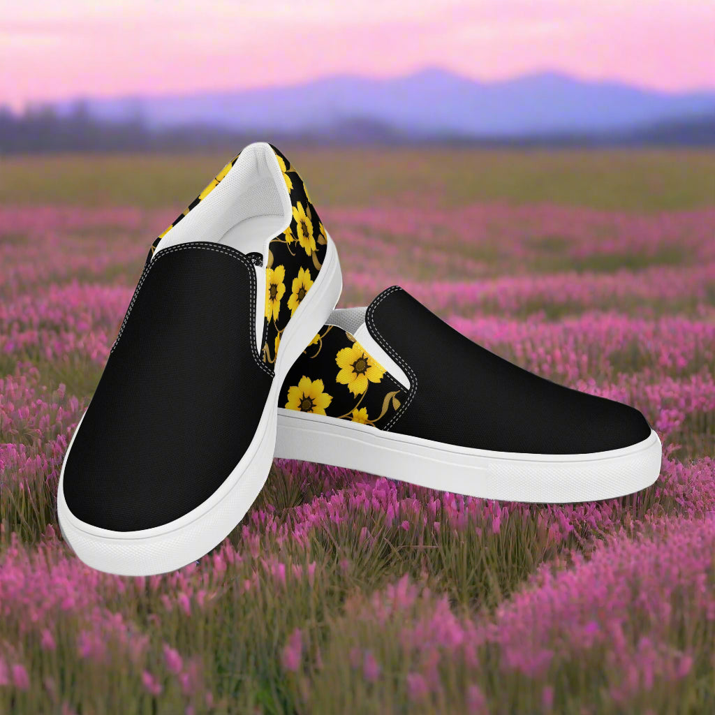 Slip-on Canvas Shoes Yellow Bloom Two Tone with black and yellow floral design against a scenic background