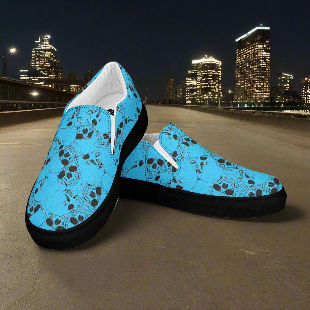 WildSage Market blue slip on skull pattern shoes with black soles on city street at night