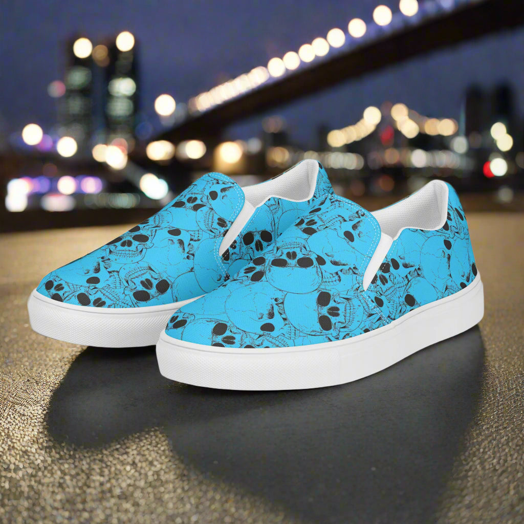WildSage Market slip on shoes featuring a blue slip on skull pattern design with white soles