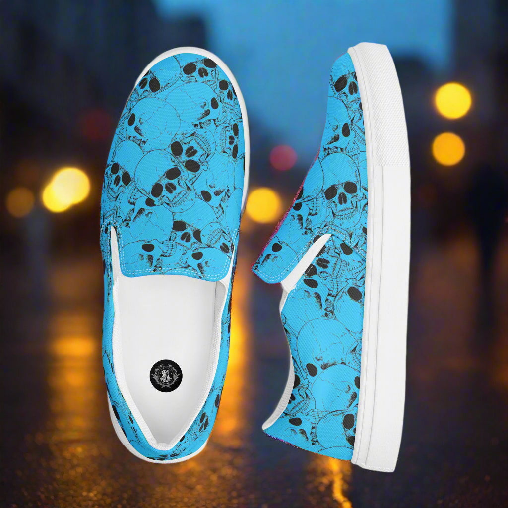 WildSage Market blue slip on skull pattern shoes with white soles and black skull designs