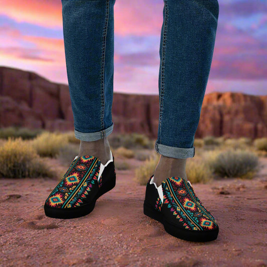 WildSage Market slip on shoes featuring a colorful Southwest print worn outdoors on rocky terrain