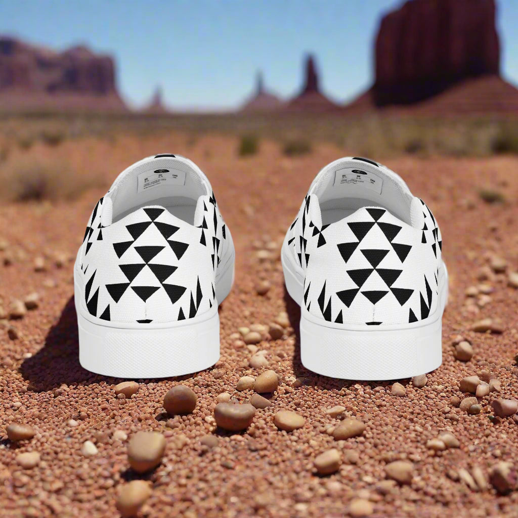 Southwest slip-on canvas shoes Sonora featuring a geometric black and white design against a desert backdrop