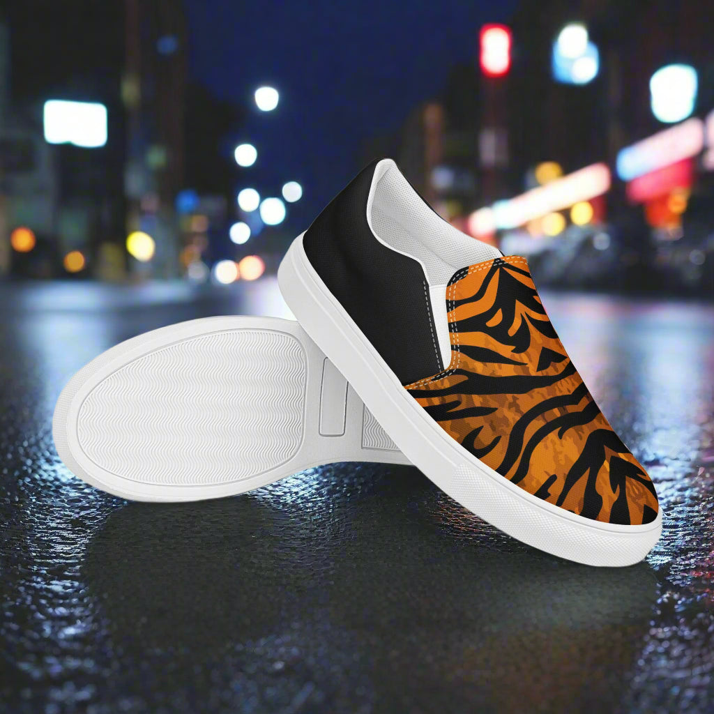 WildSage Market slip on shoes with tiger halftone pattern and black heel detail on city street background