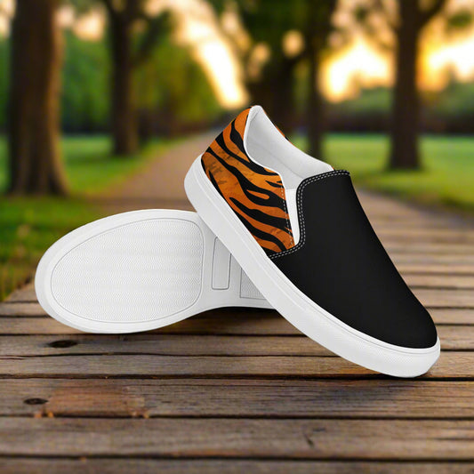 WildSage Market tiger print two tone slip on shoes with black front and white sole on wooden path