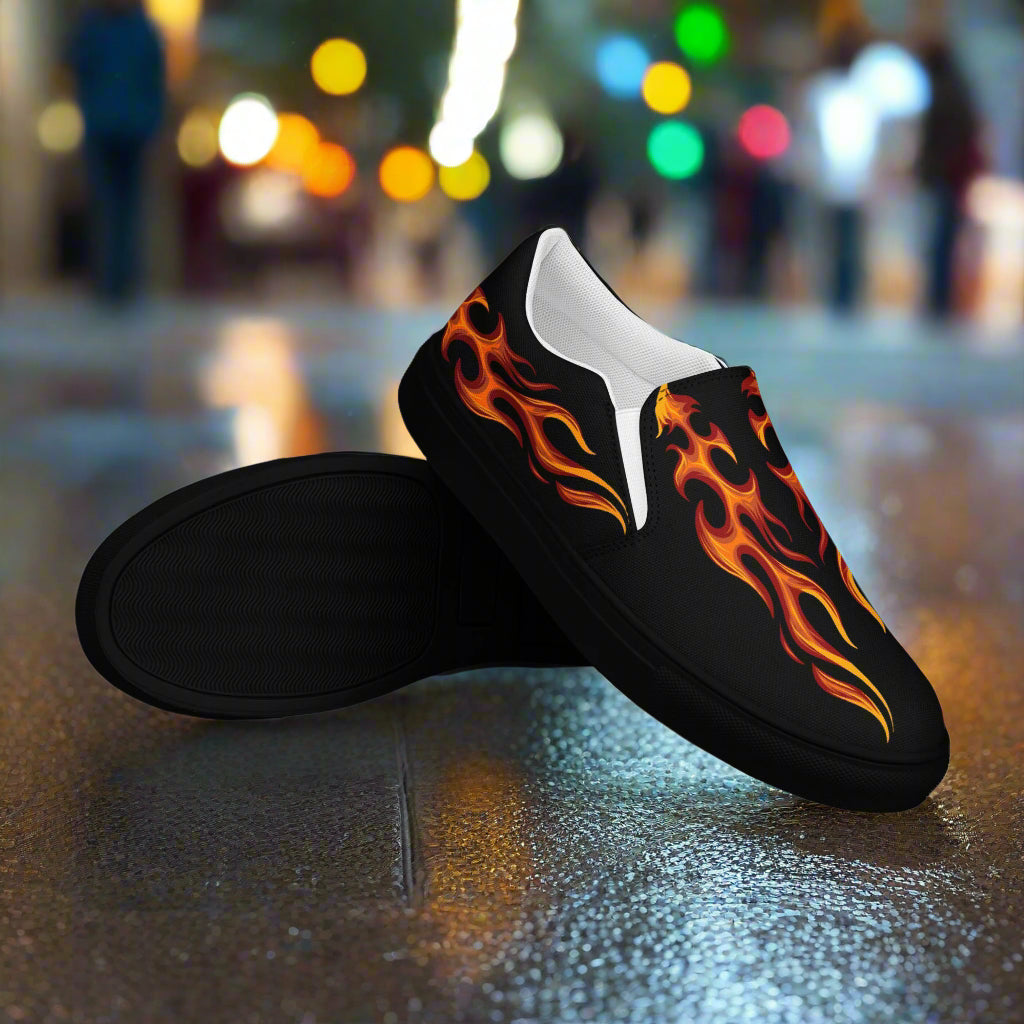 Tribal flame design canvas slip-ons from WildSage Market featuring vibrant fire patterns on a black background
