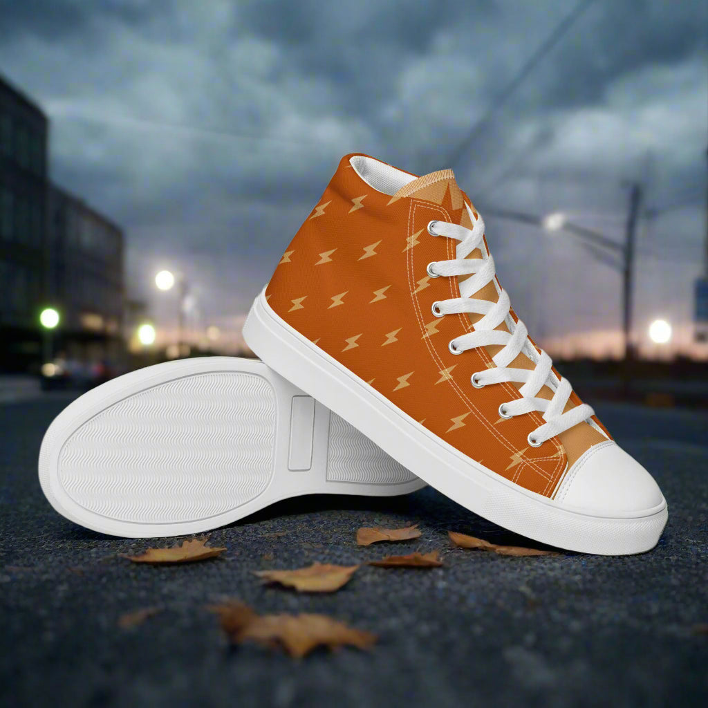 WildSage Market orange lightning bolt High Top Canvas Shoes with white laces and rubber toe cap on city street at dusk