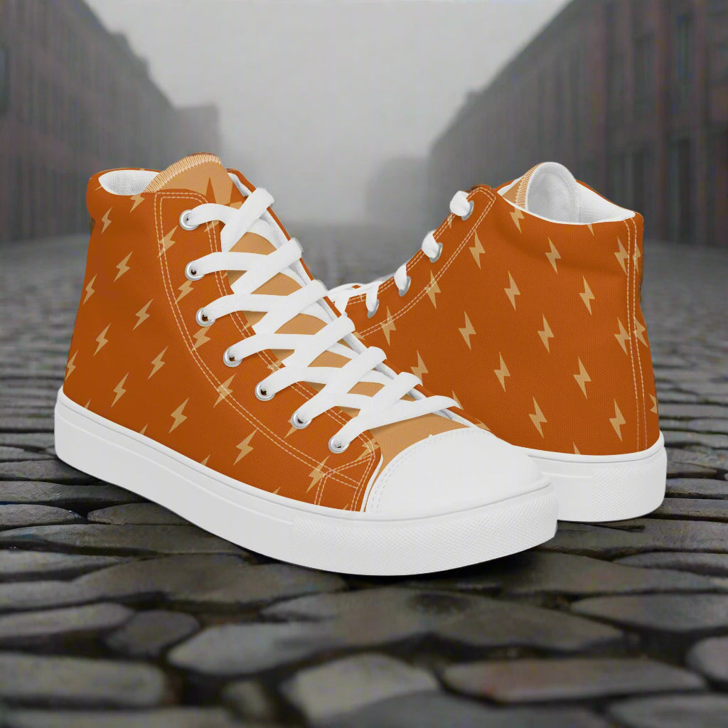 WildSage Market orange high top sneakers with lightning bolt print white toe and laces on cobblestone street High Top Canvas Shoes