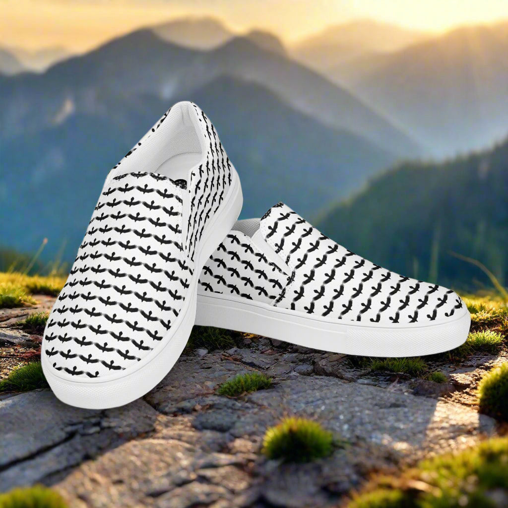 WildSage Market black raven pattern slip on shoes with white base and black raven design